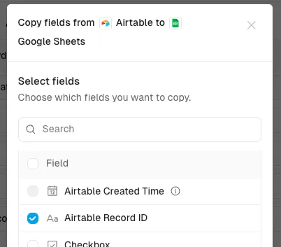 The Copy fields dialog in the mapper with Airtable Record ID selected to copy into Google Sheets